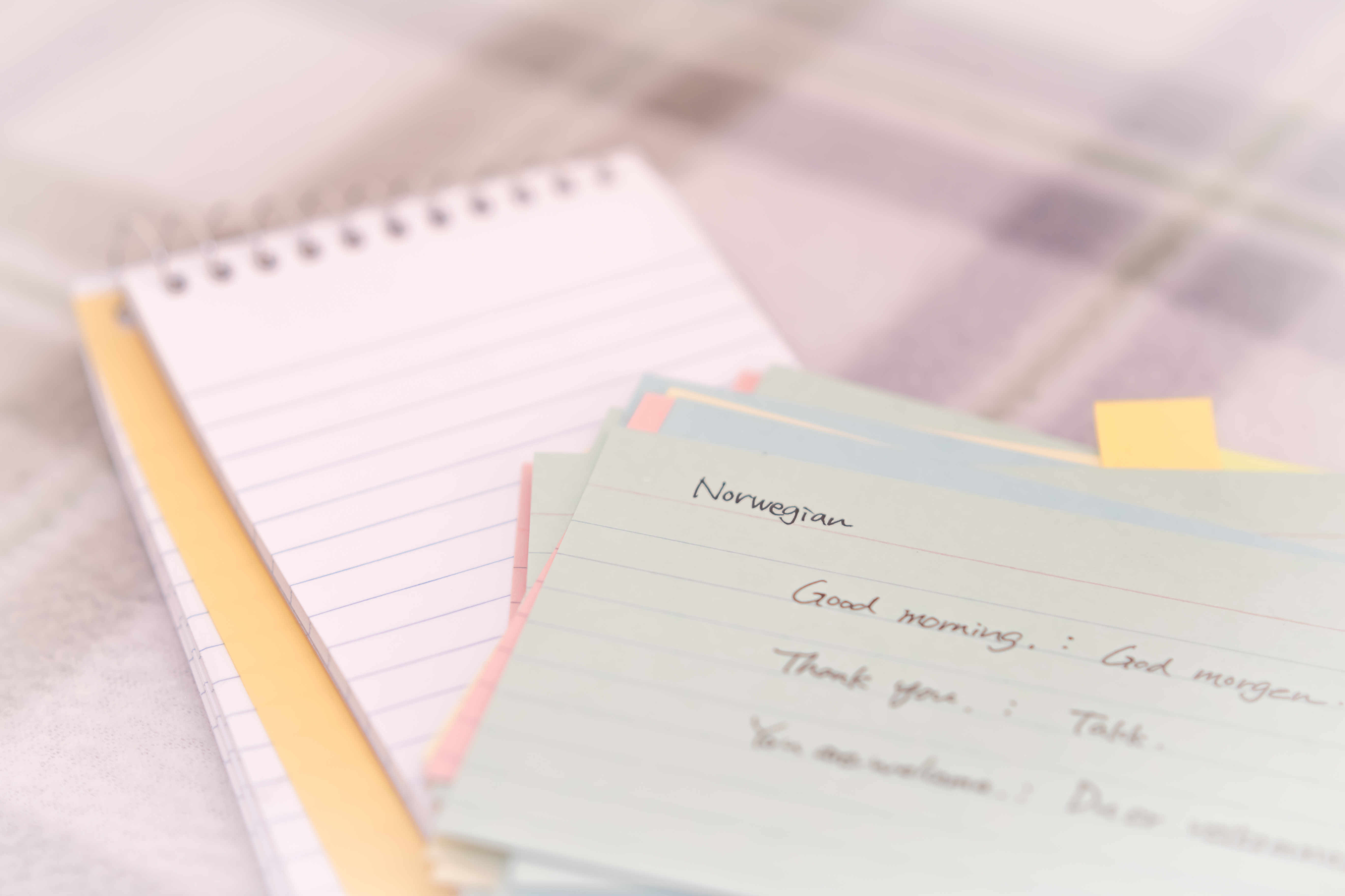 Norwegian; Learning New Language Writing Greetings on the Notebook