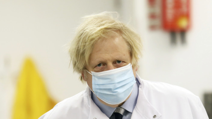 Britain Northern Ireland Boris Johnson British Prime Minister Boris Johnson during a visit to the Wellcome-Wolfson Institute For Experimental Medicine, Queen's University, Belfast, Northern Ireland, Friday, March, 12, 2021. (AP Photo/Peter Morrison /POOL)