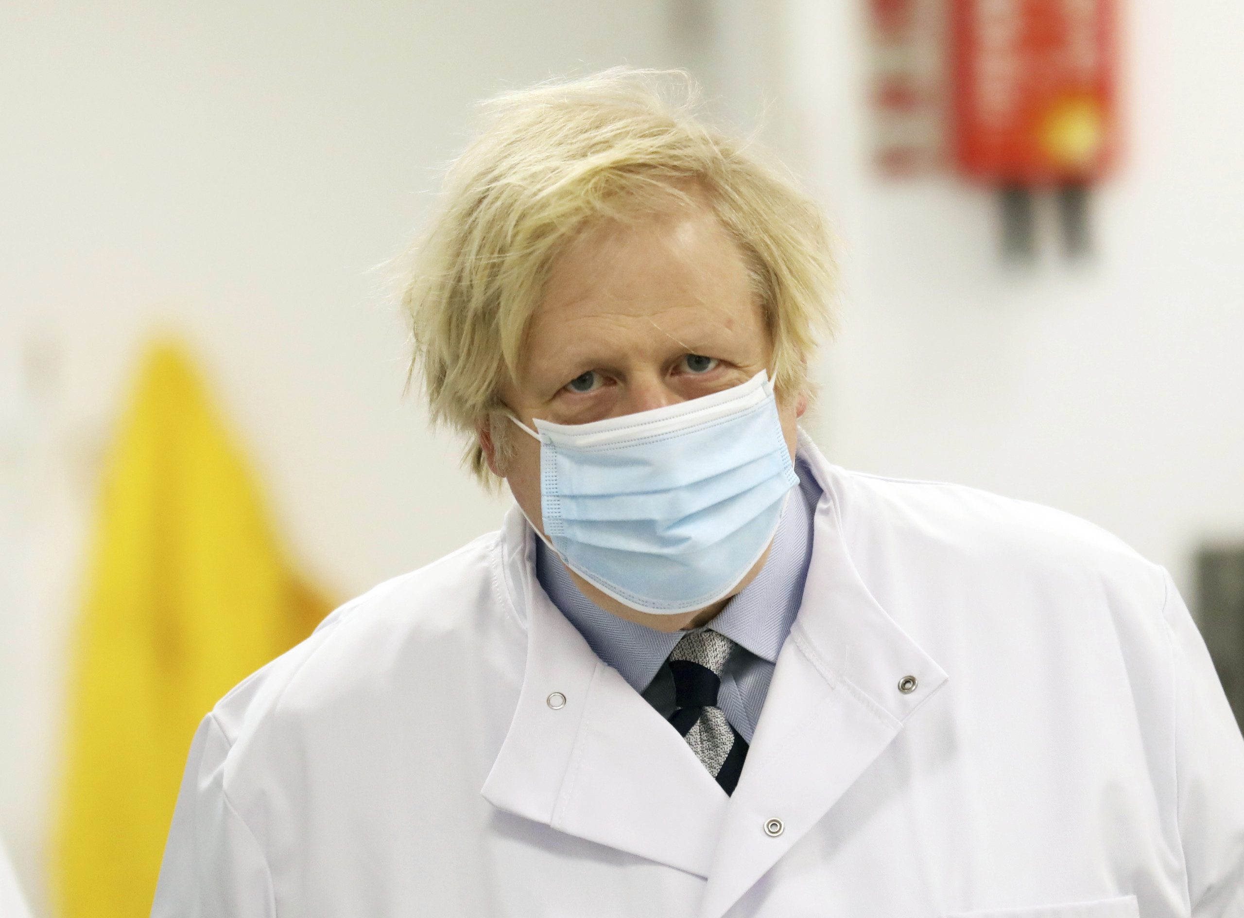 Britain Northern Ireland Boris Johnson British Prime Minister Boris Johnson during a visit to the Wellcome-Wolfson Institute For Experimental Medicine, Queen's University, Belfast, Northern Ireland, Friday, March, 12, 2021. (AP Photo/Peter Morrison /POOL)
